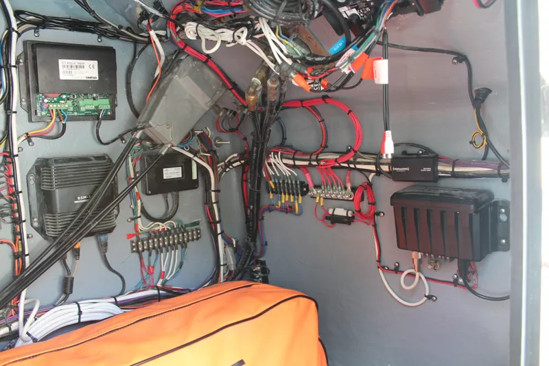 Slide: The Image of Electrical wiring and components inside a 2018 Lightning 38 Center Console boat. - 17