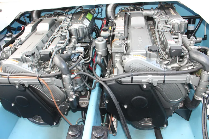 Slide: The Image of Twin engines in a 2018 Lightning 38 Center Console boat, showcasing detailed mechanical components. - 20