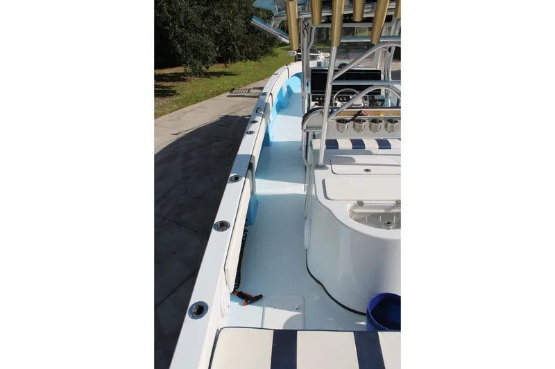 Slide: The Image of 2018 Lightning 38 Center Console boat interior with seating and rod holders. - 6