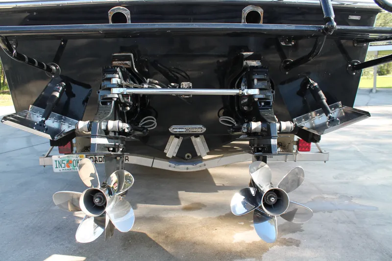 Slide: The Image of Rear view of 2018 Lightning 38 Center Console boat with dual propellers. - 24