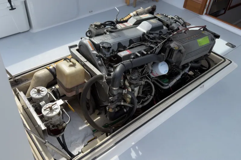 Slide: The Image of Engine compartment of a 1985 Holland 32 boat, showcasing detailed mechanical components. - 43