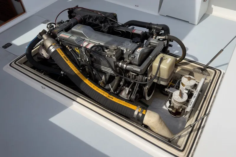 Slide: The Image of Engine compartment of a 1985 Holland 32 boat, showcasing detailed mechanical components. - 41