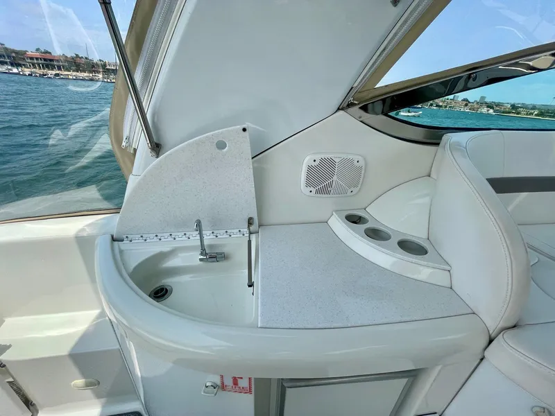 Slide: The Image of 2003 Formula 40 PC yacht interior with sink and seating area by the water. - 47