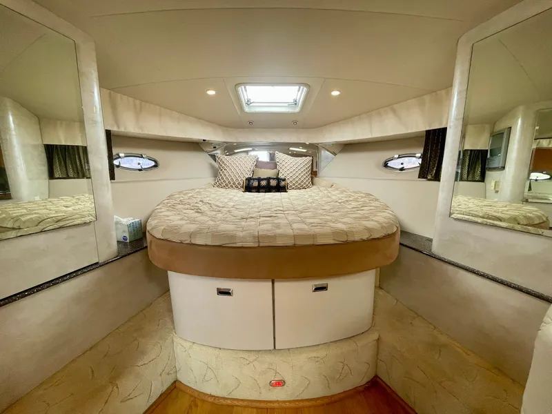 Slide: The Image of Luxurious 2003 Formula 40 PC yacht cabin with cozy bed and elegant decor. - 27