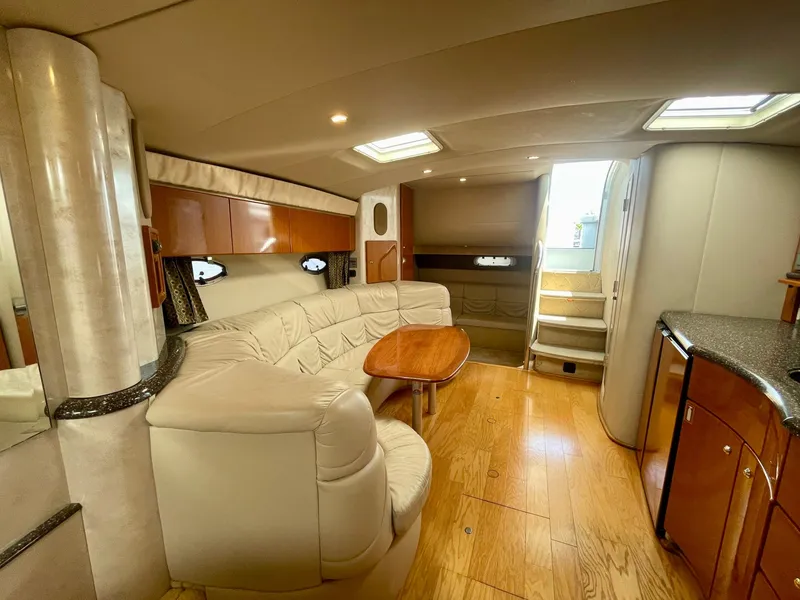 Slide: The Image of Luxurious interior of a 2003 Formula 40 PC yacht with elegant seating and wooden flooring. - 17