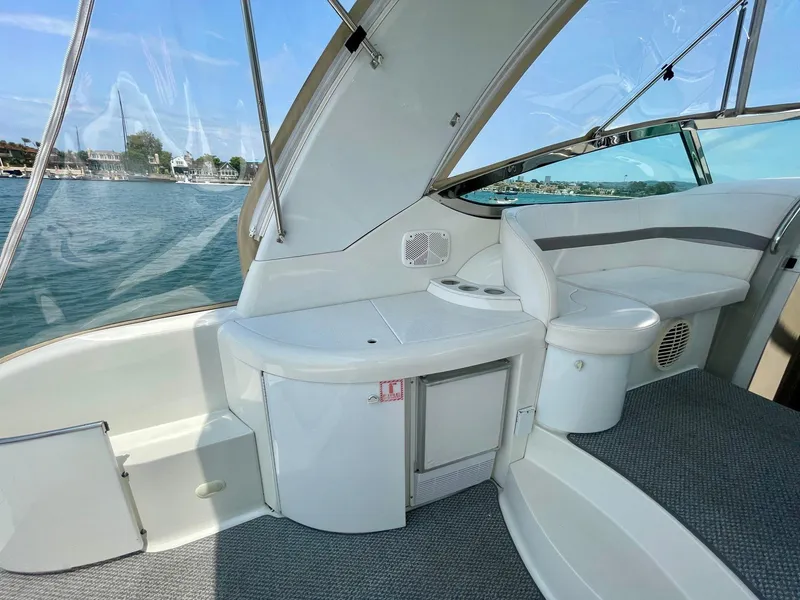 Slide: The Image of 2003 Formula 40 PC yacht interior with seating and storage, overlooking serene waters. - 45