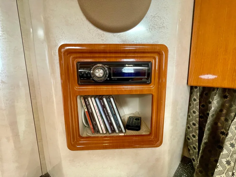 Slide: The Image of 2003 Formula 40 PC interior with stereo system and CD collection. - 14