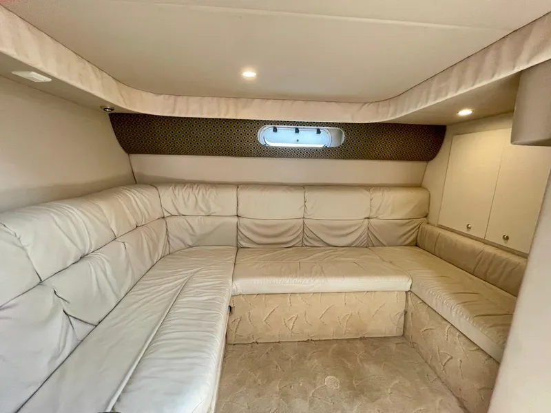 Slide: The Image of Interior of 2003 Formula 40 PC yacht with beige leather seating and ambient lighting. - 31