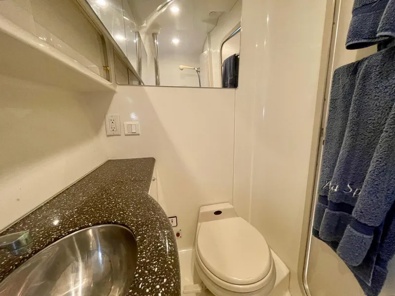 Slide: The Image of 2003 Formula 40 PC yacht bathroom with modern fixtures and granite countertop. - 41