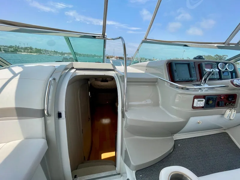 Slide: The Image of 2003 Formula 40 PC yacht cockpit with navigation controls and cabin entrance. - 46