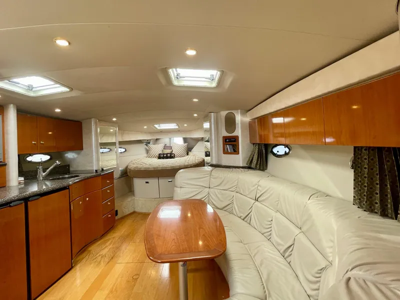 Slide: The Image of Luxurious interior of a 2003 Formula 40 PC yacht with modern amenities and elegant design. - 11