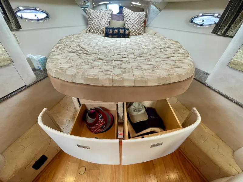 Slide: The Image of Interior of 2003 Formula 40 PC yacht with bed and open storage drawers. - 28