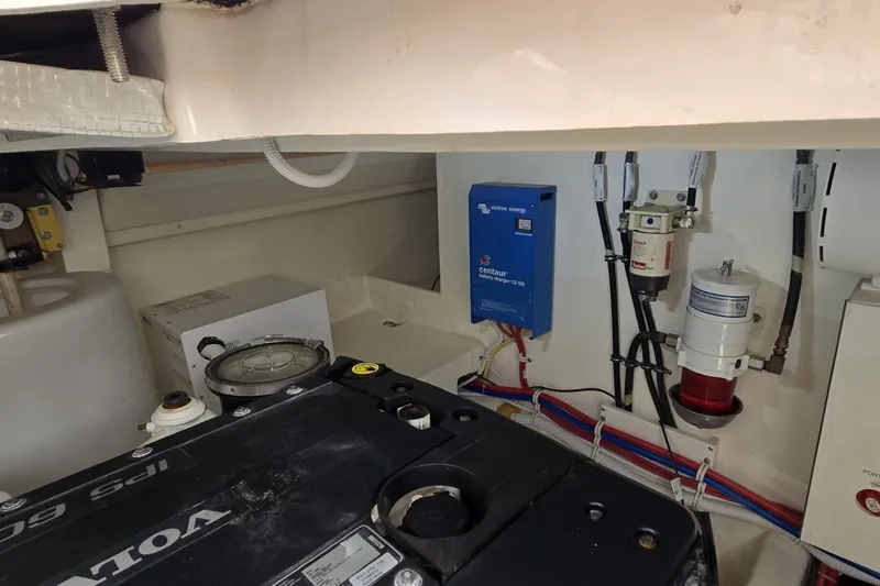Slide: The Image of Engine room of 2016 Tiara Yachts Q44 with Volvo Penta IPS system and electrical components. - 77