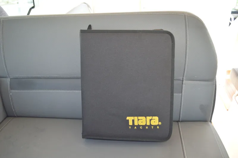 Slide: The Image of Black Tiara Yachts folder on gray seat, 2016 Q44 model. - 82