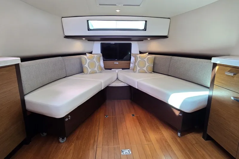 Slide: The Image of Interior of 2016 Tiara Yachts Q44 with cozy seating and modern design. - 62