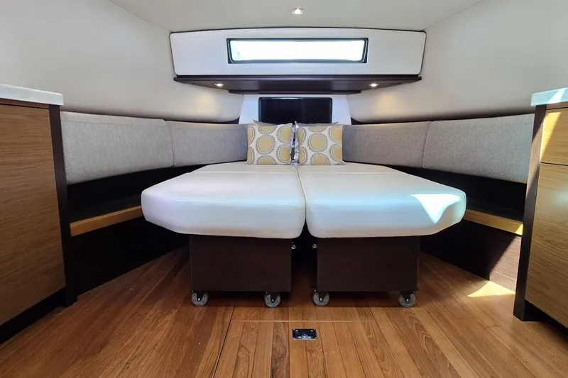Slide: The Image of Luxurious interior of 2016 Tiara Yachts Q44 with modern seating and wooden flooring. - 60