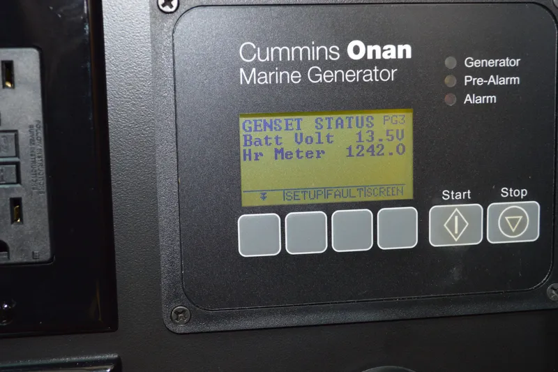 Slide: The Image of Cummins Onan marine generator display on 2016 Tiara Yachts Q44, showing battery voltage and hour meter. - 81