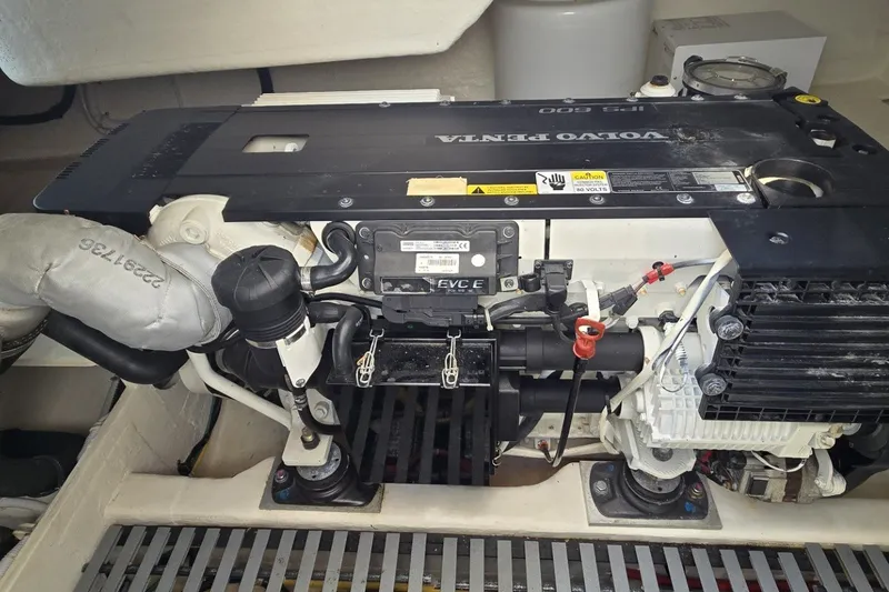 Slide: The Image of Engine compartment of a 2016 Tiara Yachts Q44, featuring a Volvo Penta engine. - 74