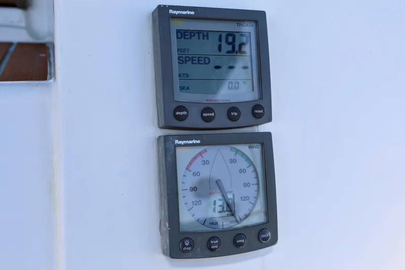 Slide: The Image of Raymarine instruments on 1990 Jeanneau Sun Magic 44, displaying depth and wind speed. - 26