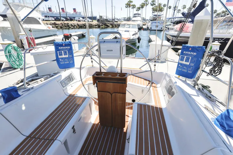 Slide: The Image of Cockpit of 1990 Jeanneau Sun Magic 44 sailboat docked at marina. - 24