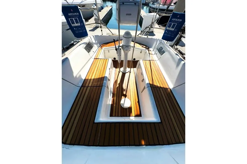 Slide: The Image of Cockpit of 1990 Jeanneau Sun Magic 44 sailboat with teak flooring and steering pedestal. - 23