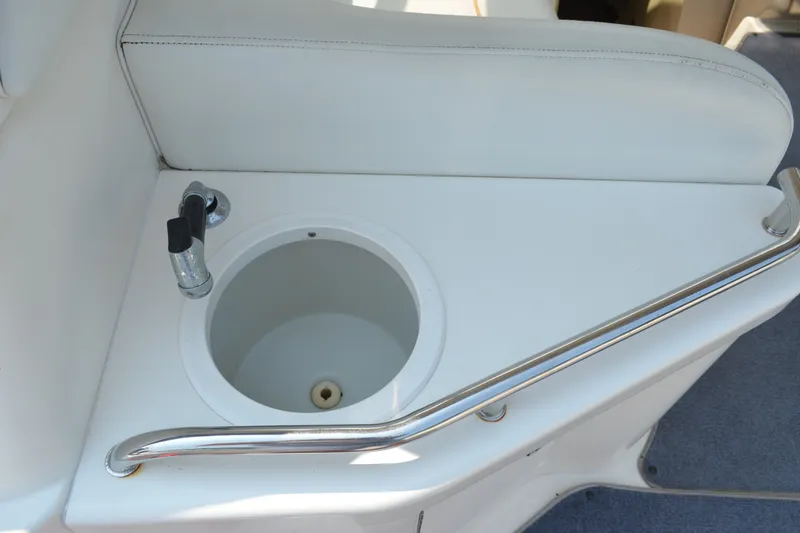 Slide: The Image of 1998 Sea Ray 290 Sundancer boat sink with faucet and railing. - 23