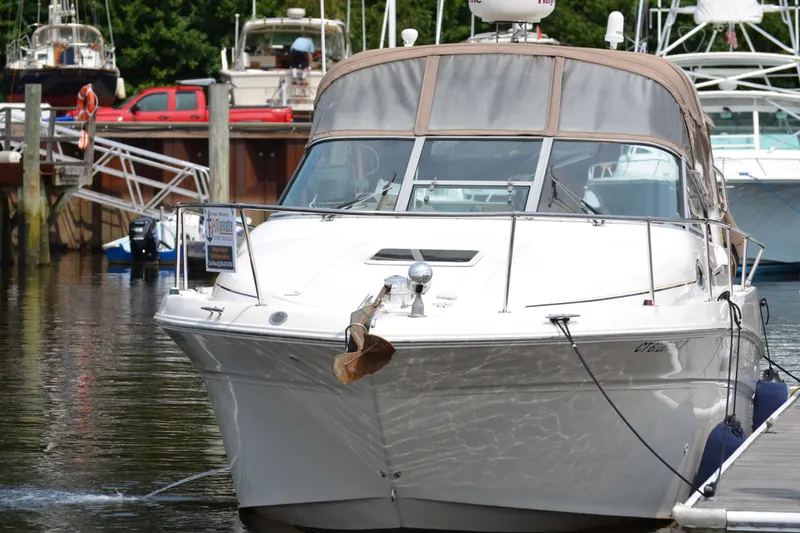 The Image of 1998 Sea Ray 290 Sundancer docked at marina, front view. - 0
