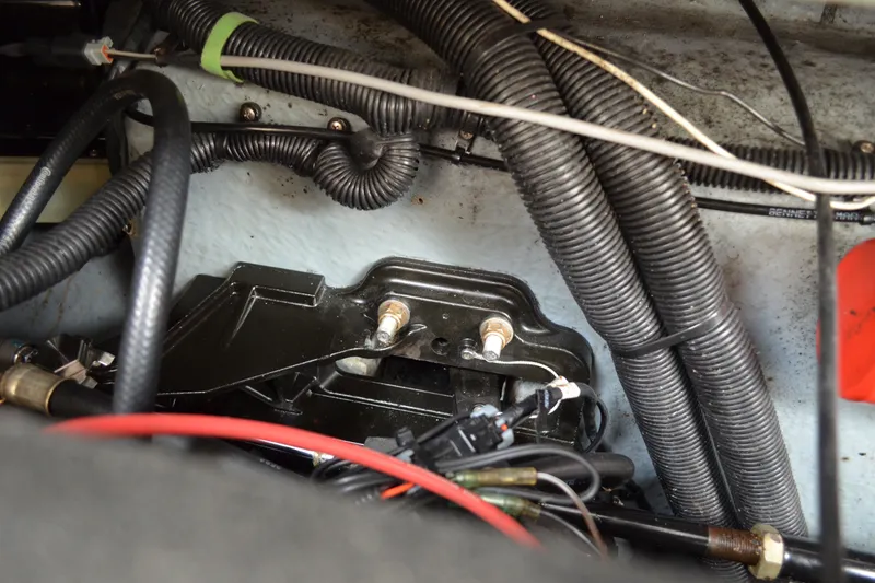 Slide: The Image of Engine compartment of a 1998 Sea Ray 290 Sundancer with visible wiring and components. - 68