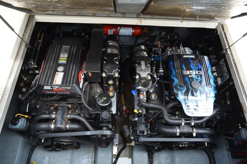 Slide: The Image of Engine compartment of a 1998 Sea Ray 290 Sundancer with dual MerCruiser engines. - 60