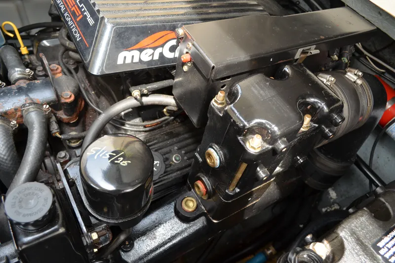 Slide: The Image of Engine of a 1998 Sea Ray 290 Sundancer boat, featuring MerCruiser components. - 63