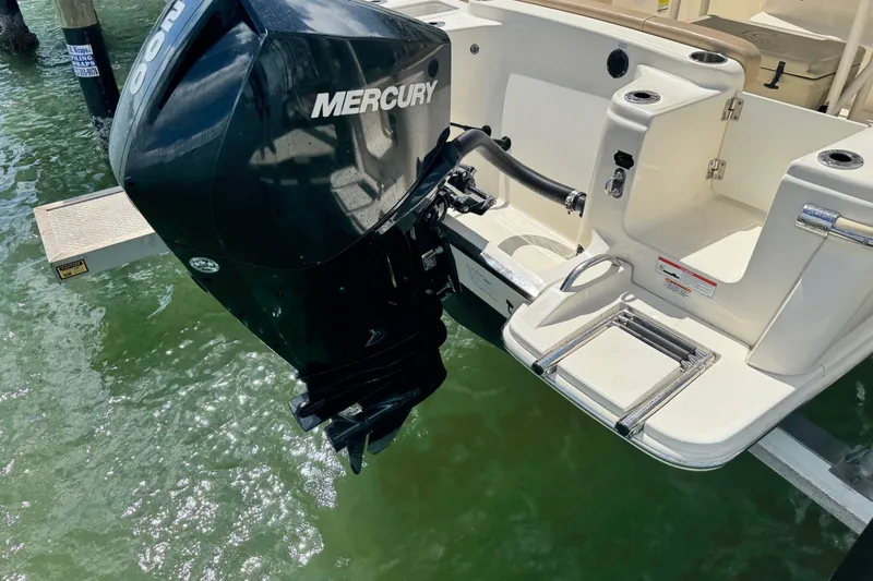 Slide: The Image of 2022 Scout 215 XSF boat with Mercury outboard motor in water. - 50