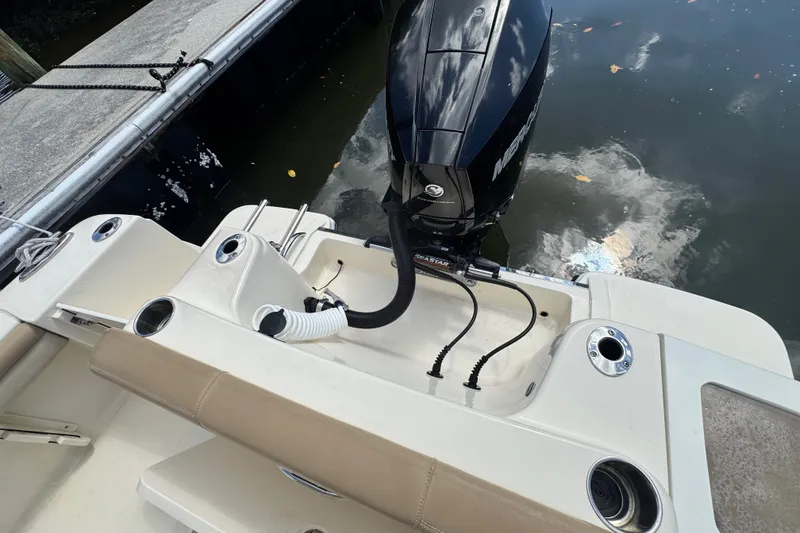 Slide: The Image of 2022 Scout 215 XSF boat with Mercury outboard engine at dockside. - 39