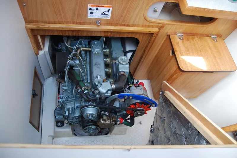 Slide: The Image of Engine compartment of a 2005 Catalina 36 MkII sailboat, showcasing detailed mechanical components. - 33