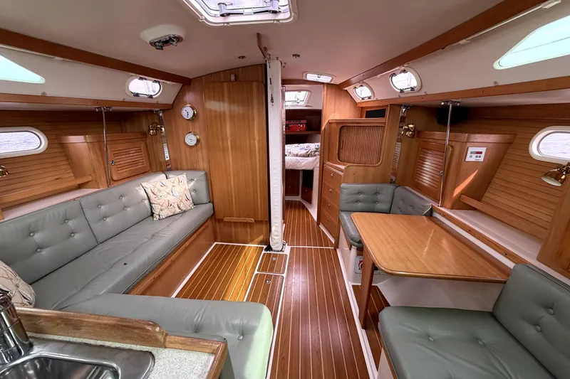 Slide: The Image of Interior of a 2005 Catalina 36 MkII sailboat with wood finish and seating area. - 3