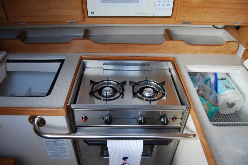 Slide: The Image of Compact galley kitchen in 2005 Catalina 36 MkII sailboat with stove and storage. - 27