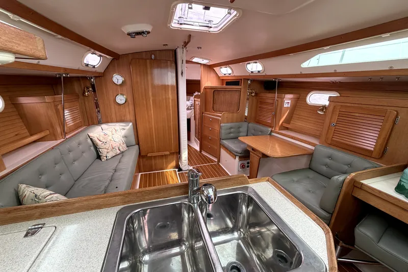 Slide: The Image of Interior of 2005 Catalina 36 MkII sailboat with wood finish and cozy seating area. - 4