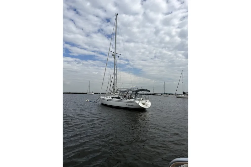 Slide: The Image of Sailboat Catalina 36 MkII 2005 on calm water under cloudy sky. - 2