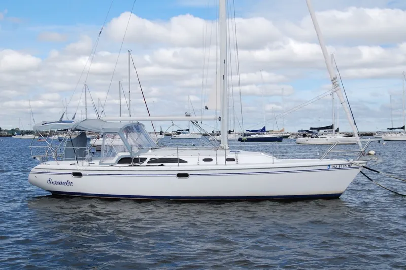 The Image of 2005 Catalina 36 MkII sailboat anchored on a calm, cloudy day. - 0