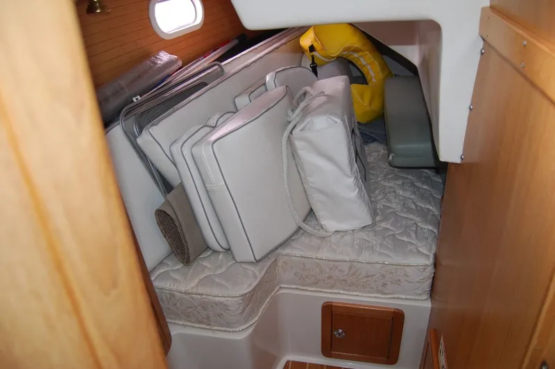 Slide: The Image of Interior cabin of a 2005 Catalina 36 MkII sailboat with cushions and life jacket. - 24