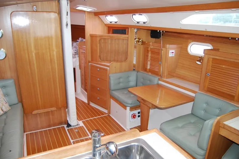 Slide: The Image of Interior of 2005 Catalina 36 MkII sailboat with wood finish and cushioned seating. - 18
