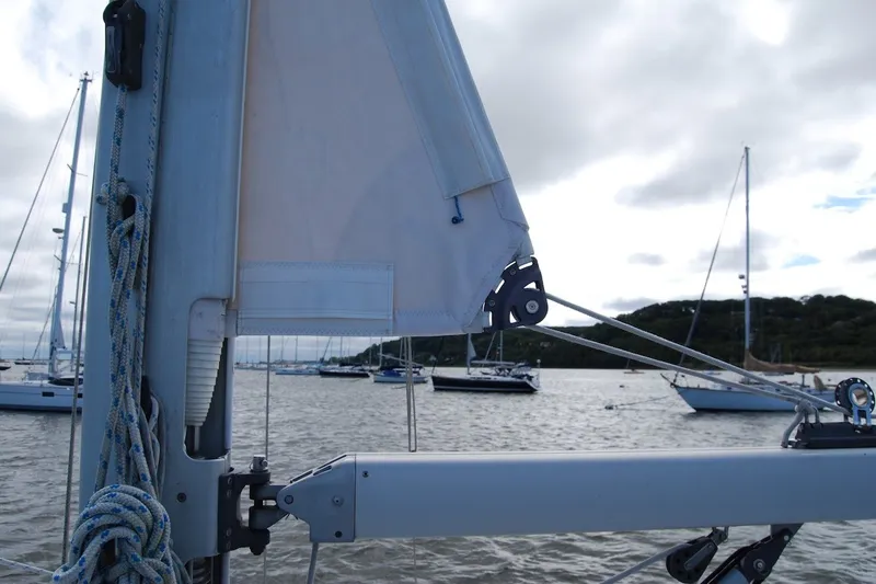 Slide: The Image of Close-up of a 2005 Catalina 36 MkII sailboat mast and rigging in a marina. - 13