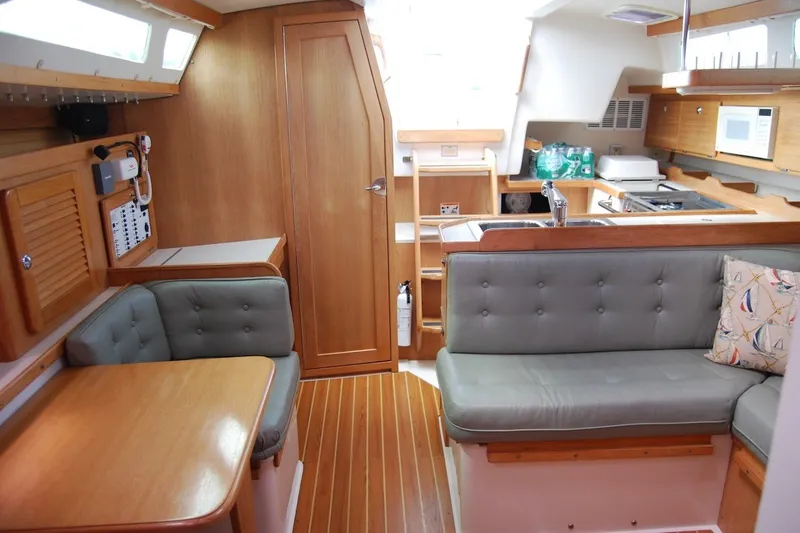Slide: The Image of Interior of 2005 Catalina 36 MkII sailboat with wood finish and cozy seating area. - 23