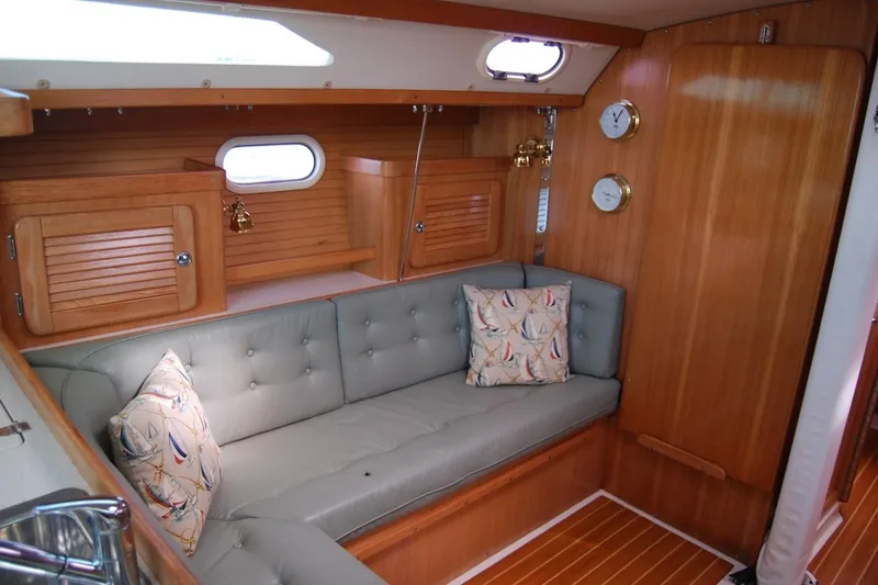 Slide: The Image of Interior of 2005 Catalina 36 MkII sailboat with cozy seating and nautical decor. - 17