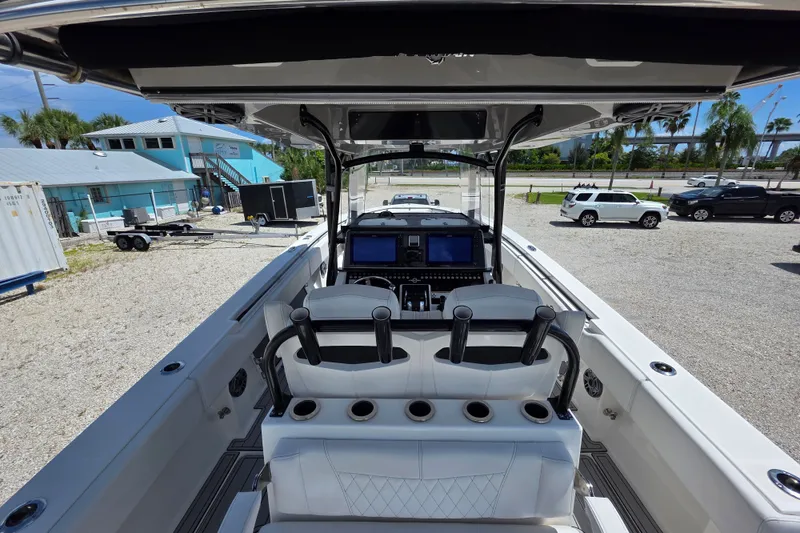Slide: The Image of 2019 Fountain 38 Center Console boat interior with helm and seating area. - 17