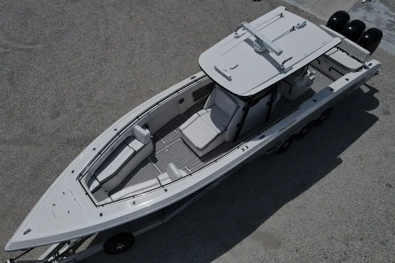 Slide: The Image of 2019 Fountain 38 Center Console boat, aerial view, sleek design, triple engines. - 20