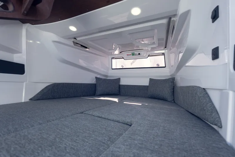 Slide: The Image of Interior cabin of 2027 Axopar 29 XC Cross Cabin with gray cushions. - 24