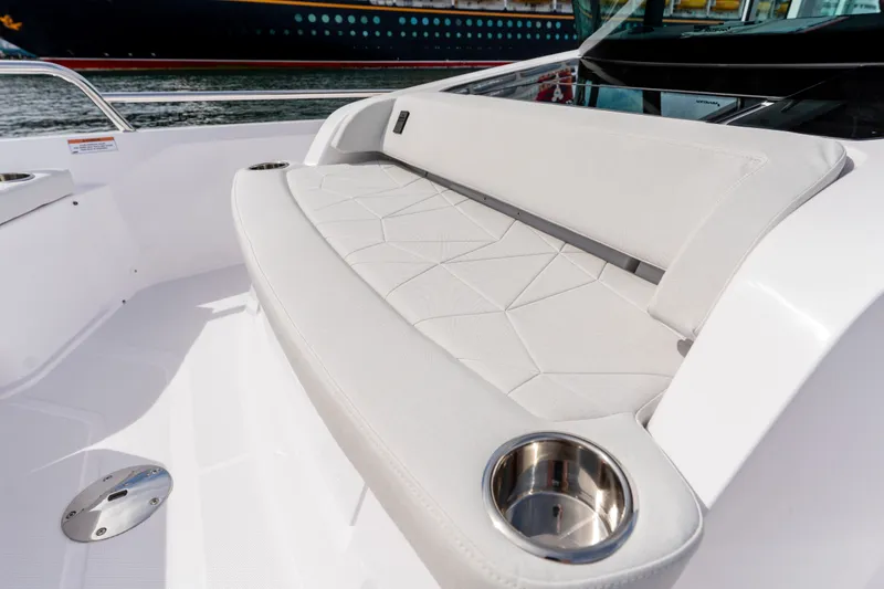 Slide: The Image of Luxurious seating on 2027 Axopar 29 XC Cross Cabin boat with cup holders. - 14