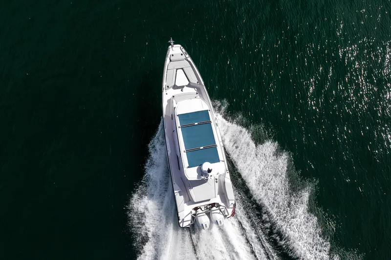 Slide: The Image of Overhead view of 2027 Axopar 29 XC Cross Cabin cruising on water. - 4