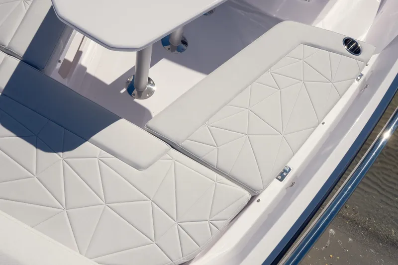 Slide: The Image of Luxurious seating on 2027 Axopar 29 XC Cross Cabin boat with geometric upholstery design. - 12
