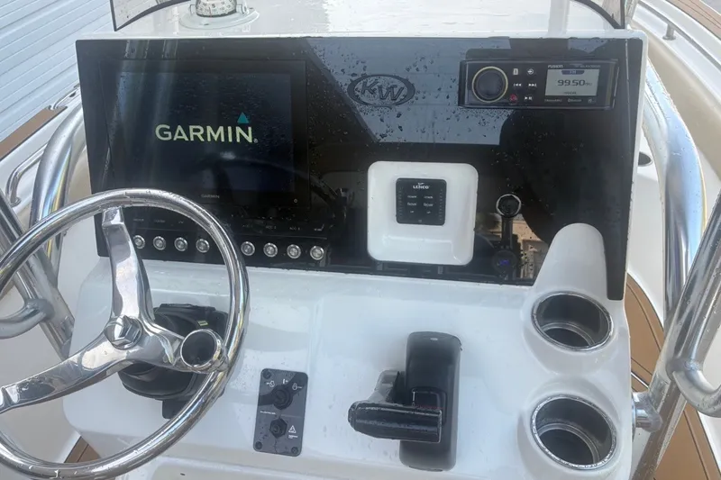 Slide: The Image of Console of a 2020 Key West 203 FS boat with Garmin navigation system. - 53